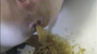 Woman shitting with power in the bathtub