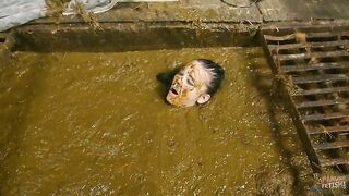 Betty completely submerges in cow shit