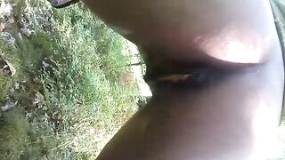 Black girl pooping in forest