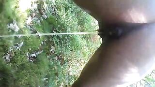 Black girl pooping in forest