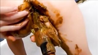 Dirty girl masturbating with lots of shit