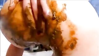 Dirty girl masturbating with lots of shit