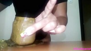 Hairy bitch pooping heavily on the table