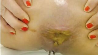 Amateur milf shitting hard in the toilet