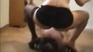 Mistress in high heels shitting on a slave's body