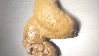 Nerdy girl spread legs and shitting