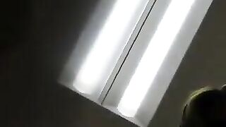 Woman pisses while squatting in the bathroom