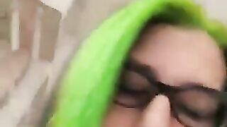 Woman pisses on tiled floor while wearing stockings