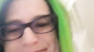 Woman pisses on tiled floor while wearing stockings