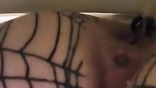 Woman pisses on tiled floor while wearing stockings