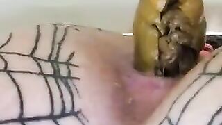 Girl in tight fishnet stockings stands over a shower drain