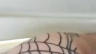 Girl in tight fishnet stockings stands over a shower drain