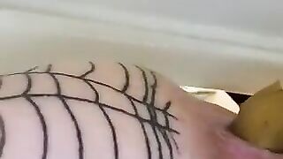 Woman in a fishnet stocking lets a cock fuck her ass in a bathtub