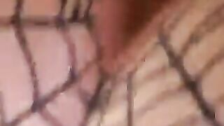 Babe squats with rope tied around ass