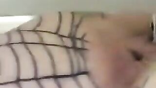 Babe squats with rope tied around ass