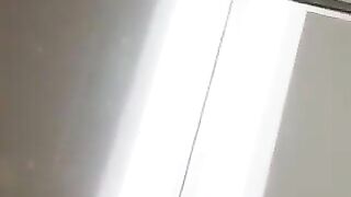 Girl with nipple ring and barbed wire bondage