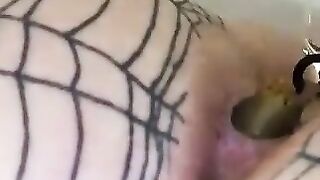 Woman pees on her fishnet stockings