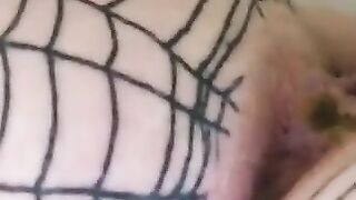 Woman pees on her fishnet stockings