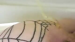 Chick covered in a fishnet stocking gets her asshole stitched