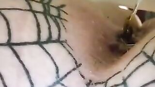 A lady passes a log on a net in her ass