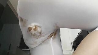 Gorgeous girl poops in her pants