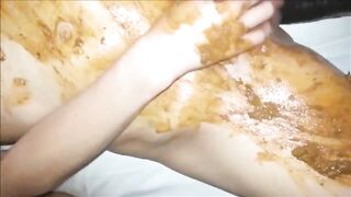 Woman bangs with dildo and smearing shit