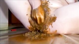 Woman masturbating with shit