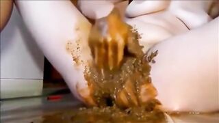 Woman masturbating with shit
