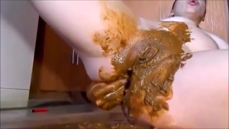 Woman masturbating with shit