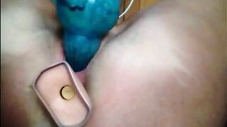 Woman masturbating with two big dildos