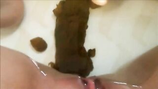 Woman shitting messy poop in the water