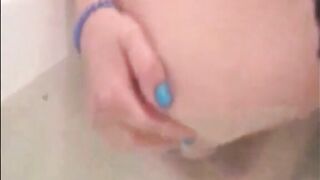 Woman shitting chunks in the water of bathtub