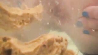 Woman shitting in the bathtub