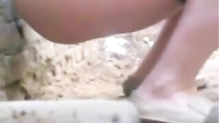 Women shits in an abandoned building