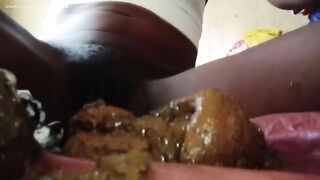 Pretty black babe poops heavily in closeup