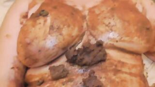 Mature lady smearing shit on her tits and pussy