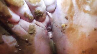 Mature lady smearing shit on her tits and pussy