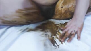 Hairy babe masturbates with shit