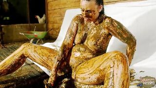 Betty playing in cowshit