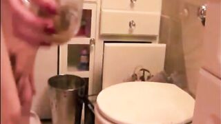 Blonde sexy girl shitting in a glass
