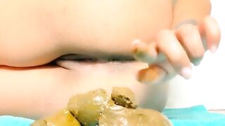 Lovely Latina babe teasing with yellow poop