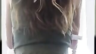 Blonde sits on a chair and lets out a shit