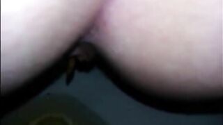 Shitting diarrhea in the toilet closeup