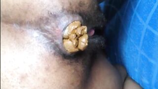 Hairy hot gal shitting an hard turd