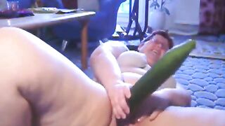 Chubby naughty girl masturbates with huge cucumber