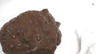 Closeup of cute brunette girl poops