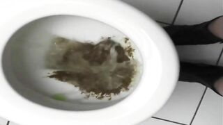 Skinny brunette milf poops hard