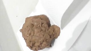 Babe in long black boots pooping in the toilet