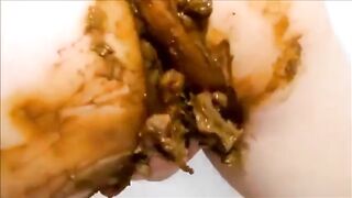 Milf smearing shit on her body while masturbating with dildo