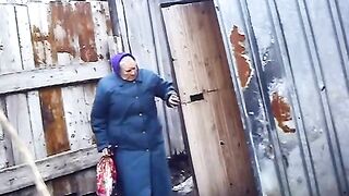 Old Russian granny poops in the backyard
